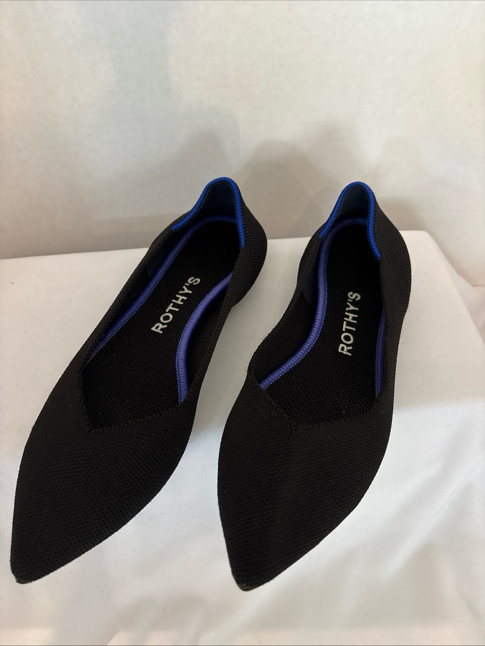 Rothy's Women’s Black Pointed Toe Flats with Blue Trim - size W6